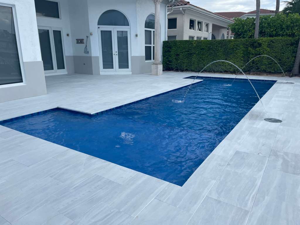 Pool resurfaced with azure plaster finish in South Florida